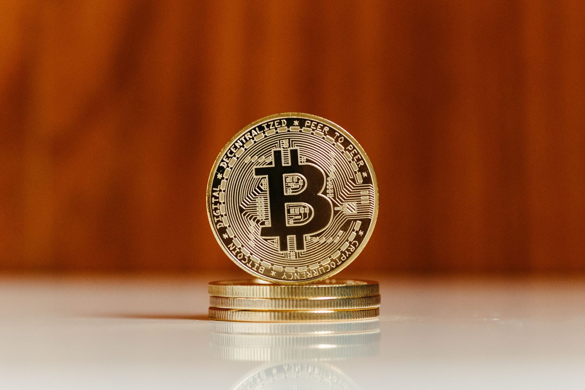 Bitcoin coins stacked on a desk